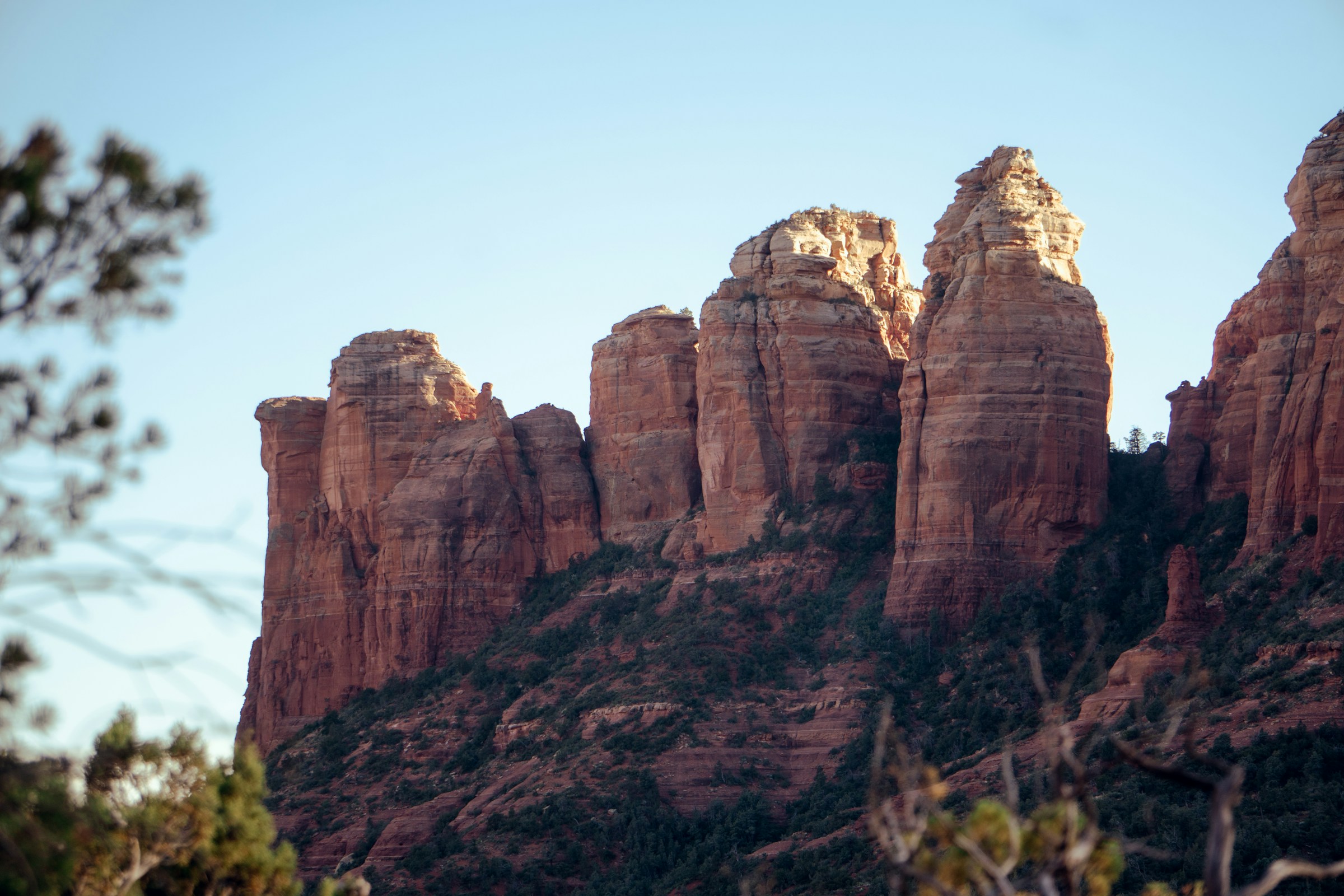 Red sandstone formations above the desert at Sedona in clear low light
